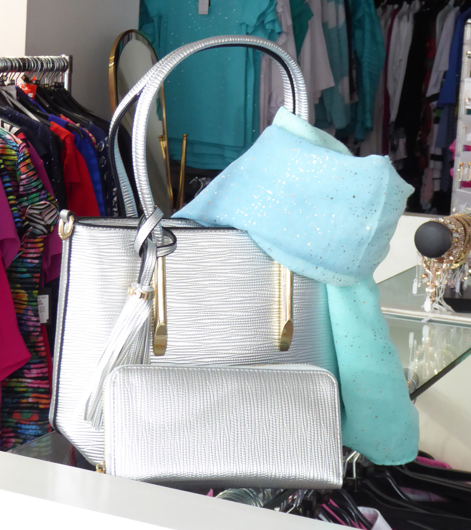 a  display of a handbag and accessories 